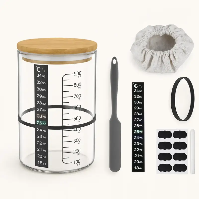 Everything in the Essential Set laid out: the graduated jar, wooden lid, spatula, cloth cover, elastic band, thermometer strip, label sheet and pen