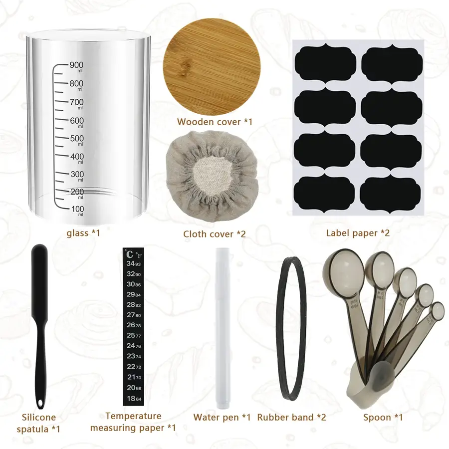 The full set of sourdough tools laid out and labeled: 900 ml graduated jar, wooden lid, cloth covers, chalk labels, silicone spatula, thermometer strip, marker pen, elastic bands and measuring spoons